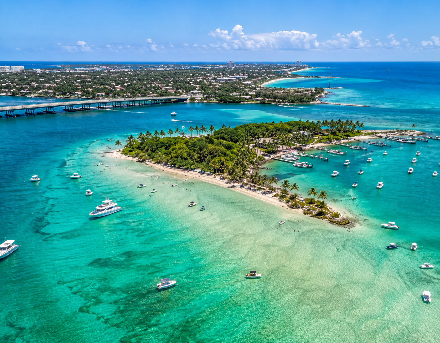 Palm Beach — aerial view of Peanut Island with turquoise lagoons, sandbar, and anchored boats
